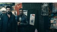 Posters on the walls of the TruthCon festival (image via Prime Video)